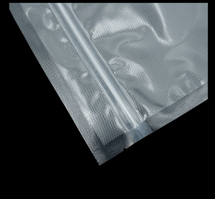 La tirette de scelleur de vide de nourriture met en sac de poly poches en nylon texturisées de vide