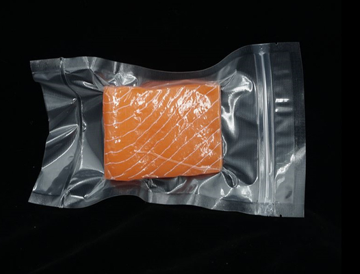 La tirette de scelleur de vide de nourriture met en sac de poly poches en nylon texturisées de vide